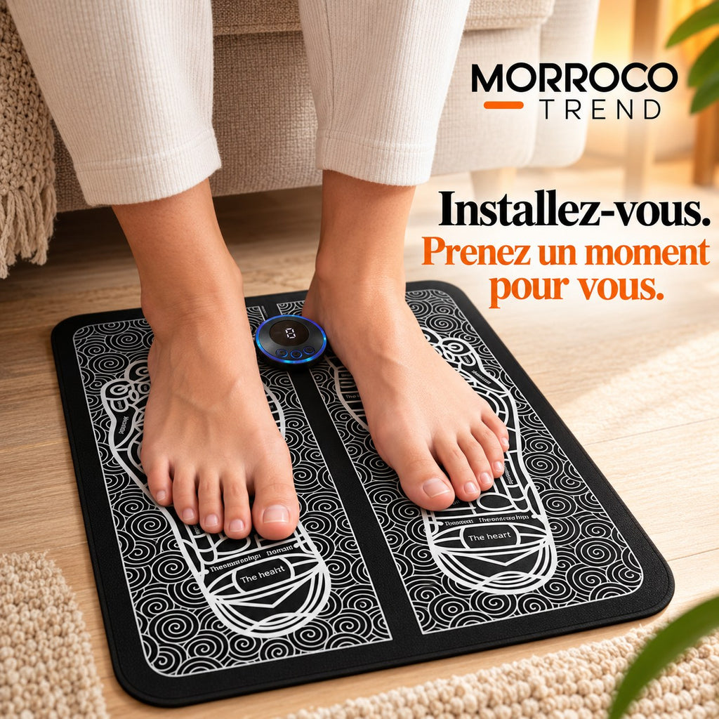 Pieds posés sur le tapis de massage EMS